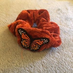 Orange scrunchie with a butterfly